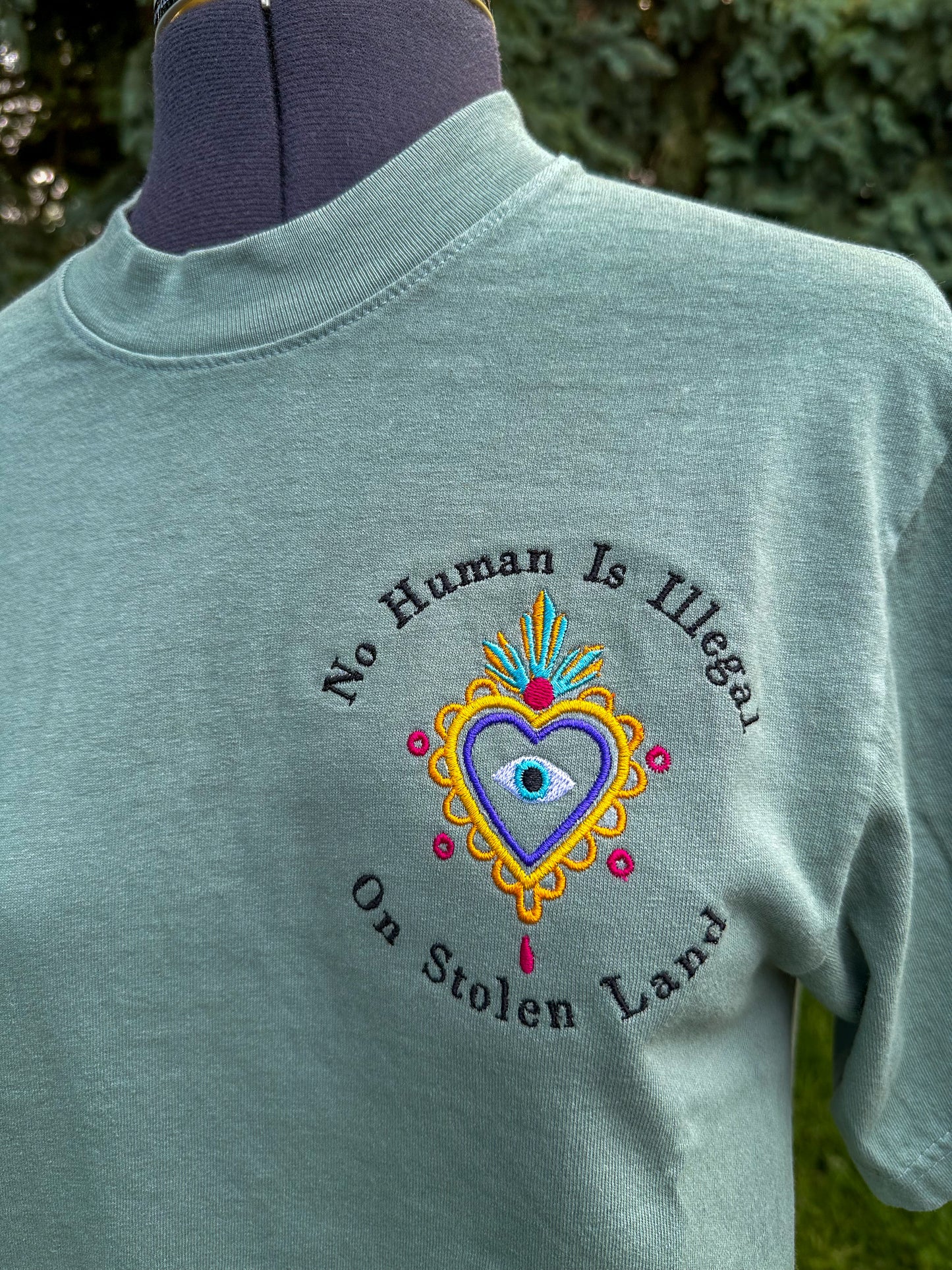 No Human Is Illegal on Stolen Land Embroidered Tshirt